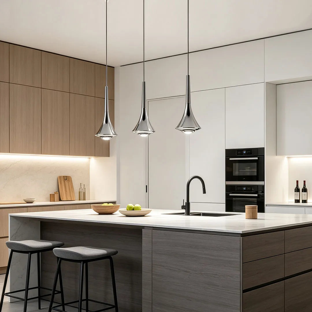 Goccia teardrop pendants over a kitchen island