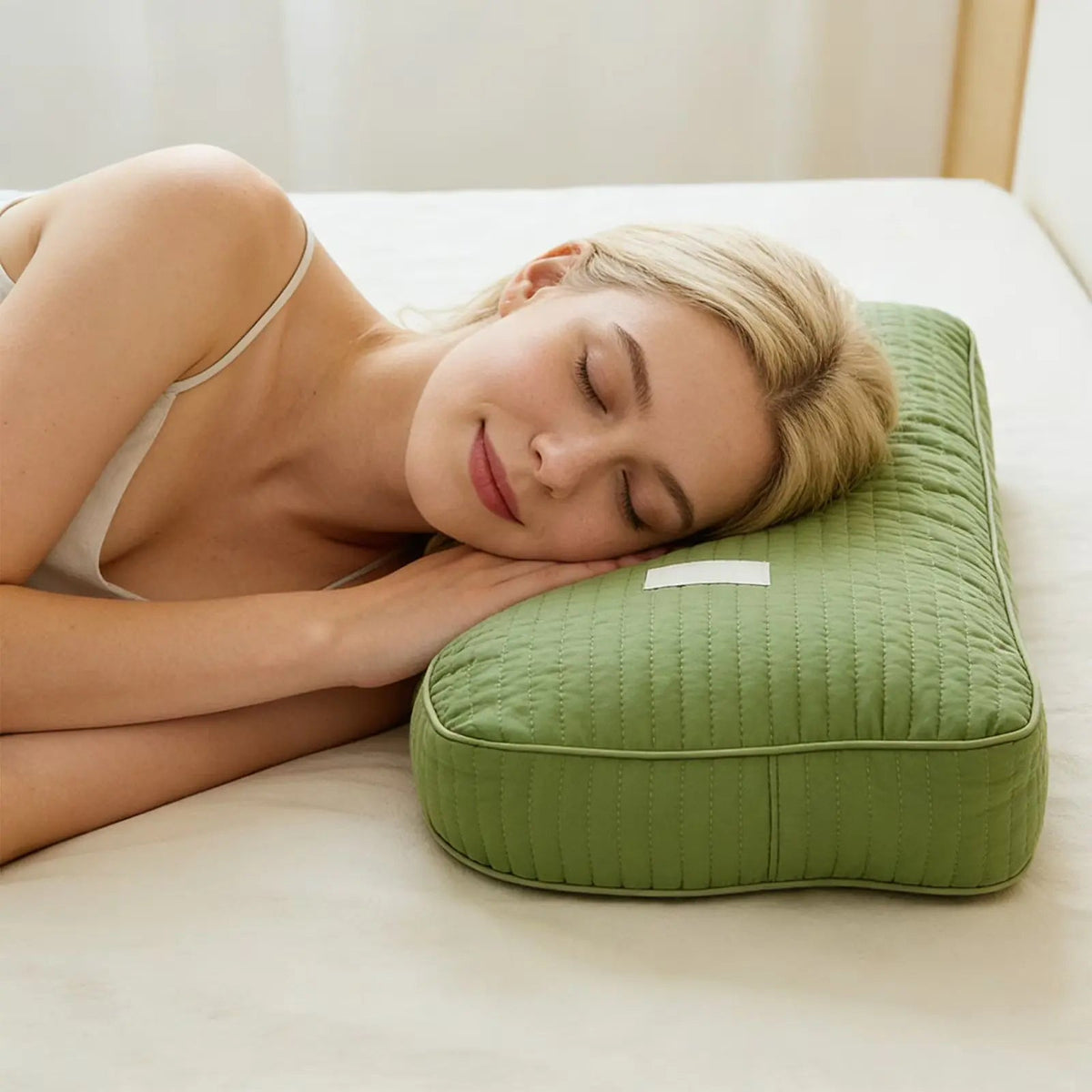 Woman sleeping on a Light Green buckwheat pillow