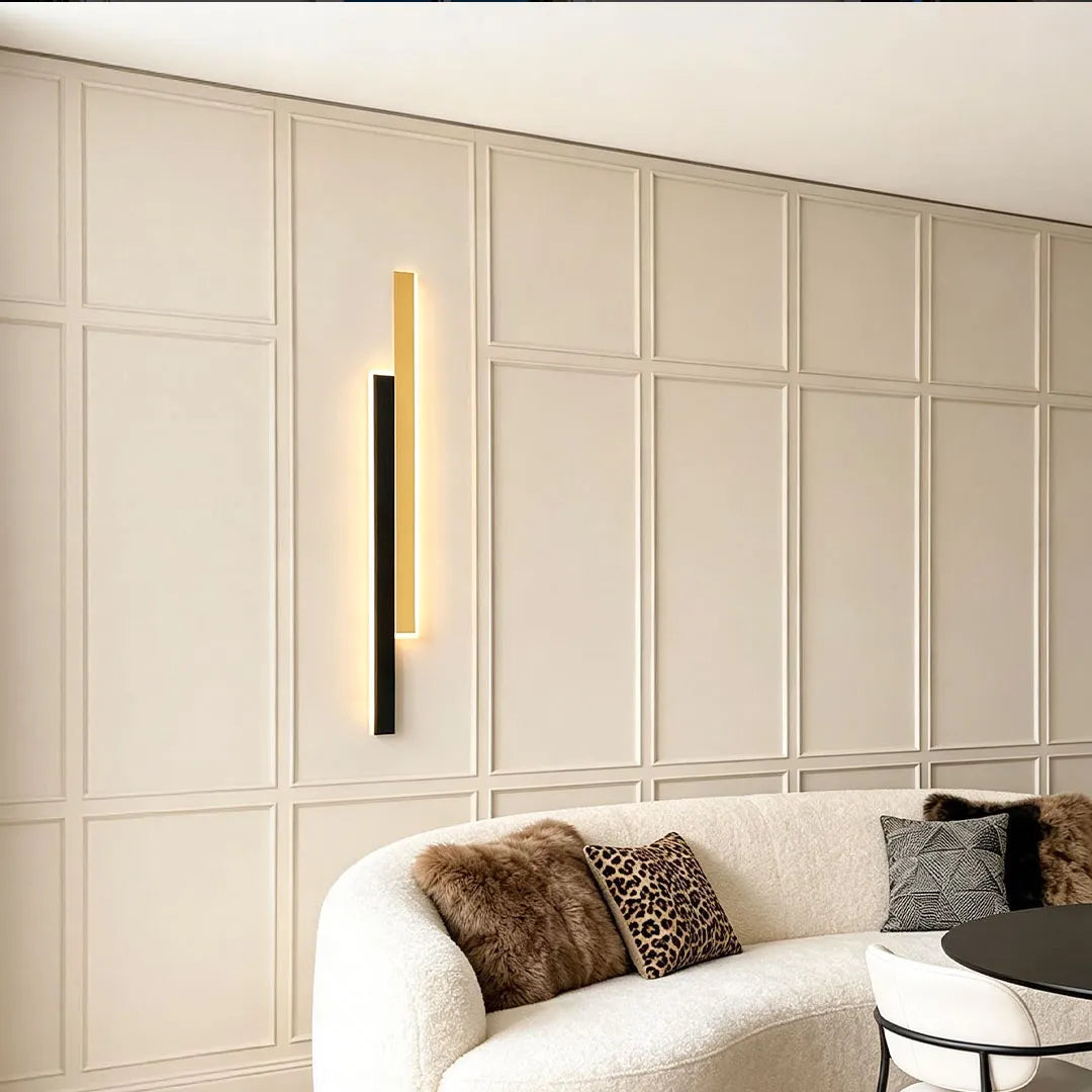 Doppia vertical wall light beside a sofa