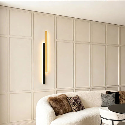 Doppia vertical wall light beside a sofa