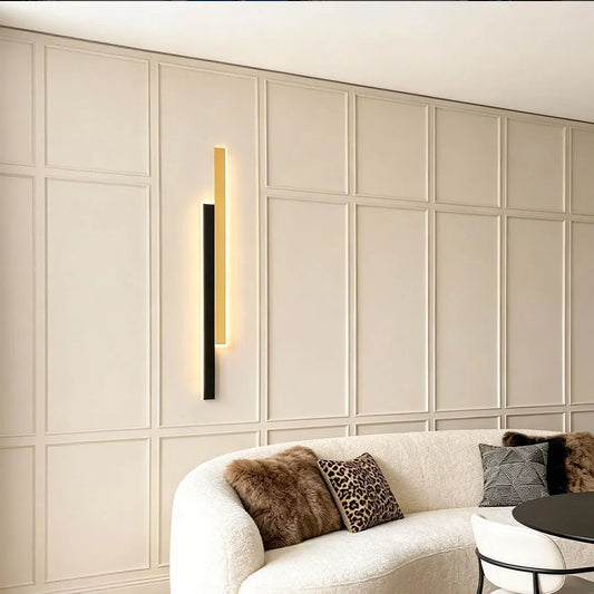 Doppia vertical wall light beside a sofa