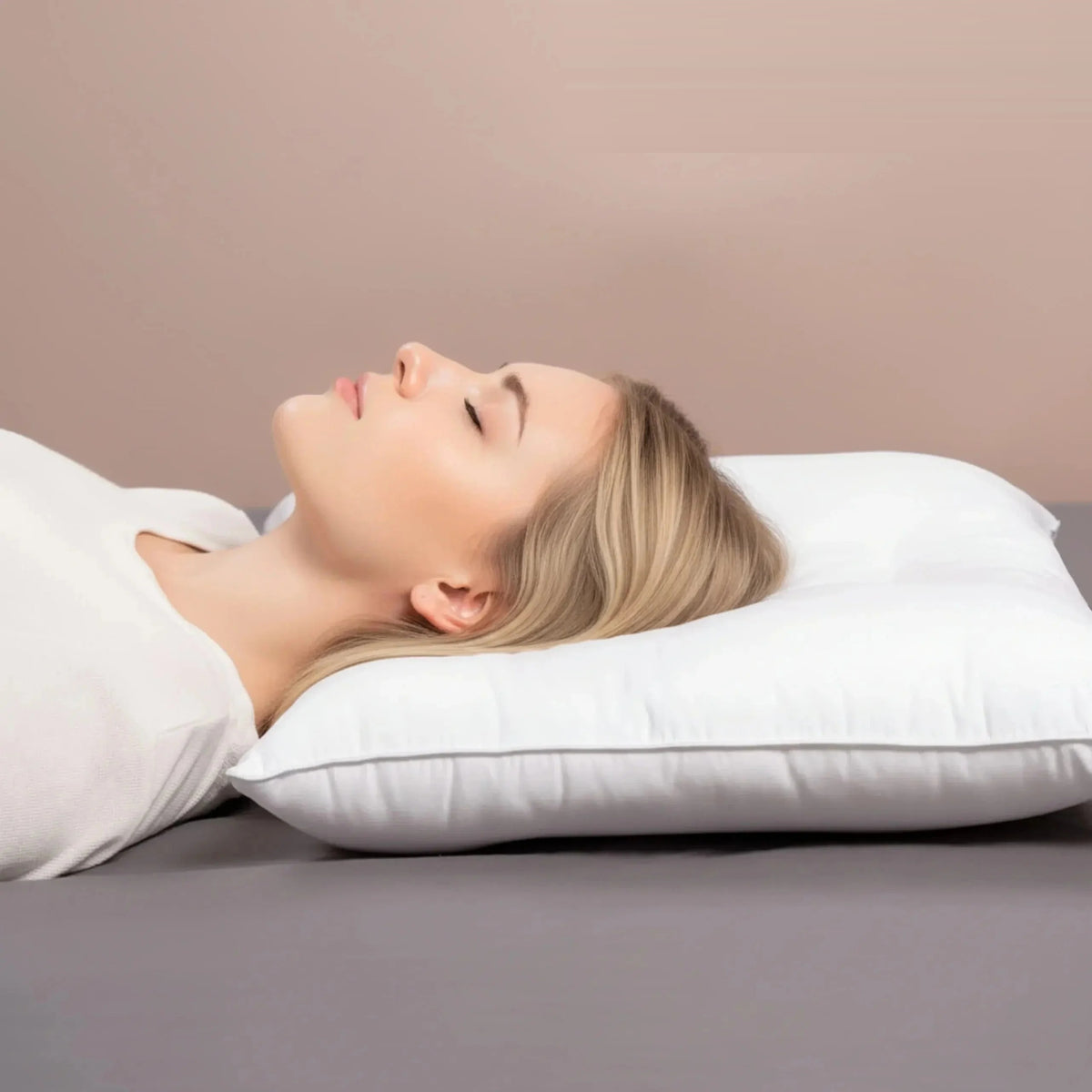 Woman sleeping on her back on a white low loft cotton pillow