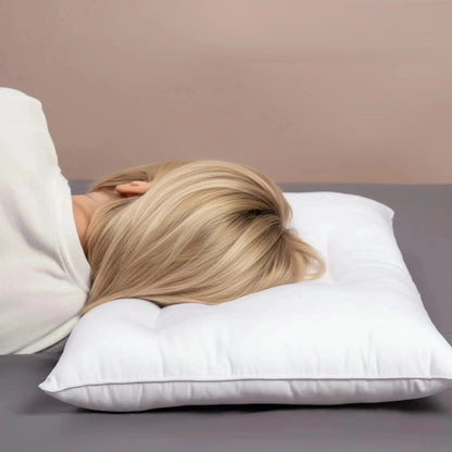 Woman resting on a white low loft cotton pillow